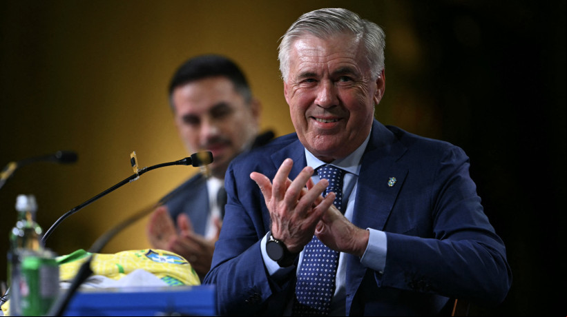 Brazil's football team new head coach, Italian Carlo Ancelotti, applauds during his official presentation at a hotel in Barra da Tijuca neighbourhood, Rio de Janeiro, Brazil, on May 26, 2025. (Photo by Mauro PIMENTEL / AFP)